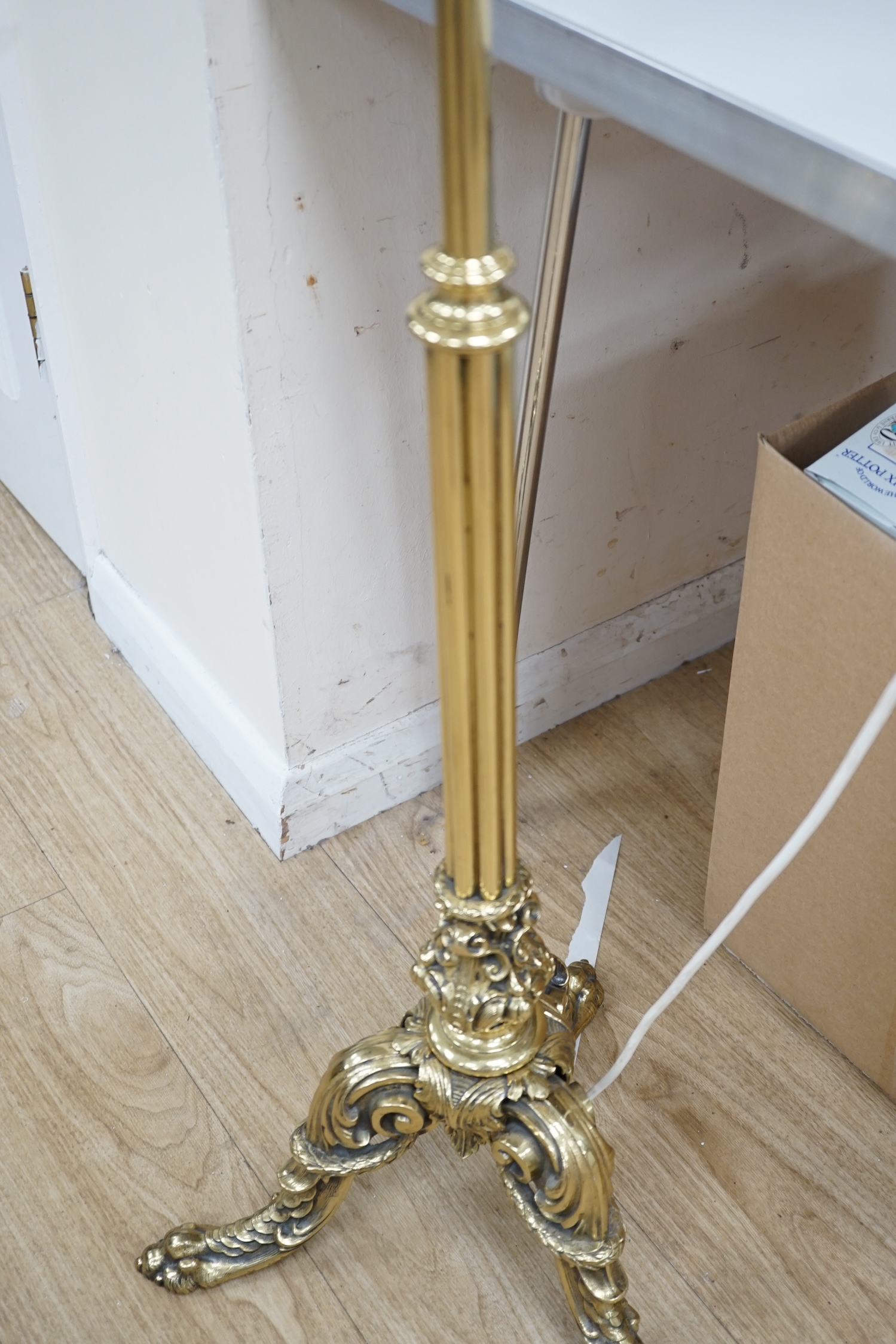 A modern brass standard lamp on tripod feet, 150cm. Condition - fair to good. Not tested as working